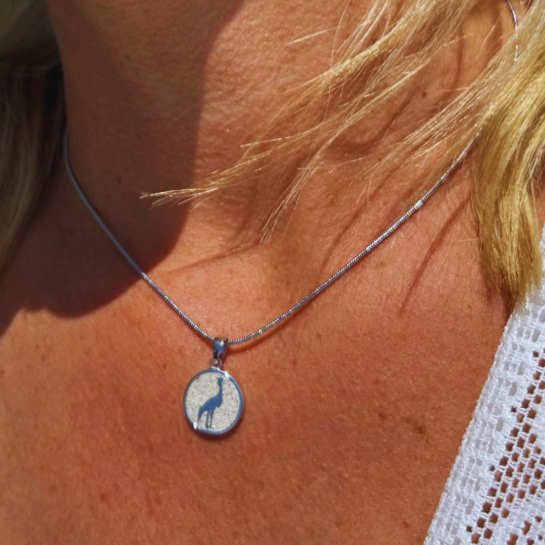 kettenanhaenger kranich strandsand